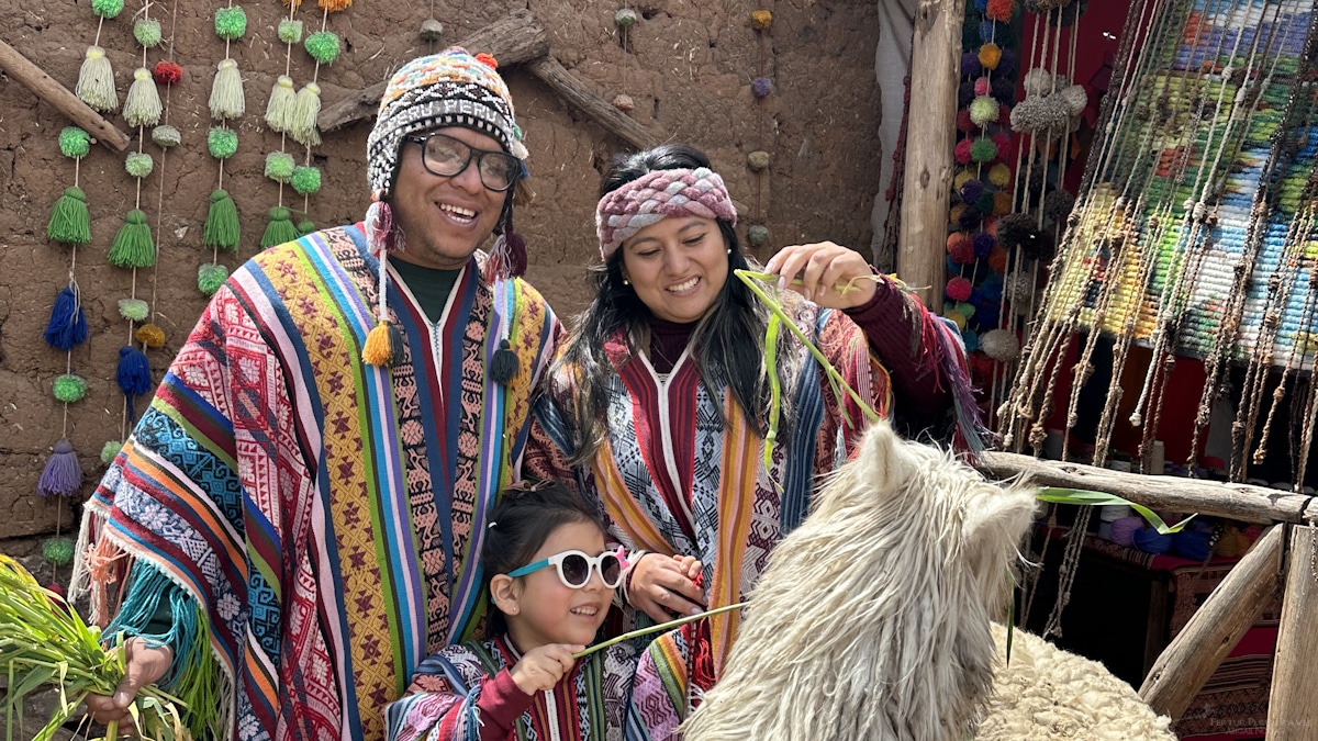 A couple enjoy a family vacation in Cusco with their little girl as part of a Peru itinerary 14 days